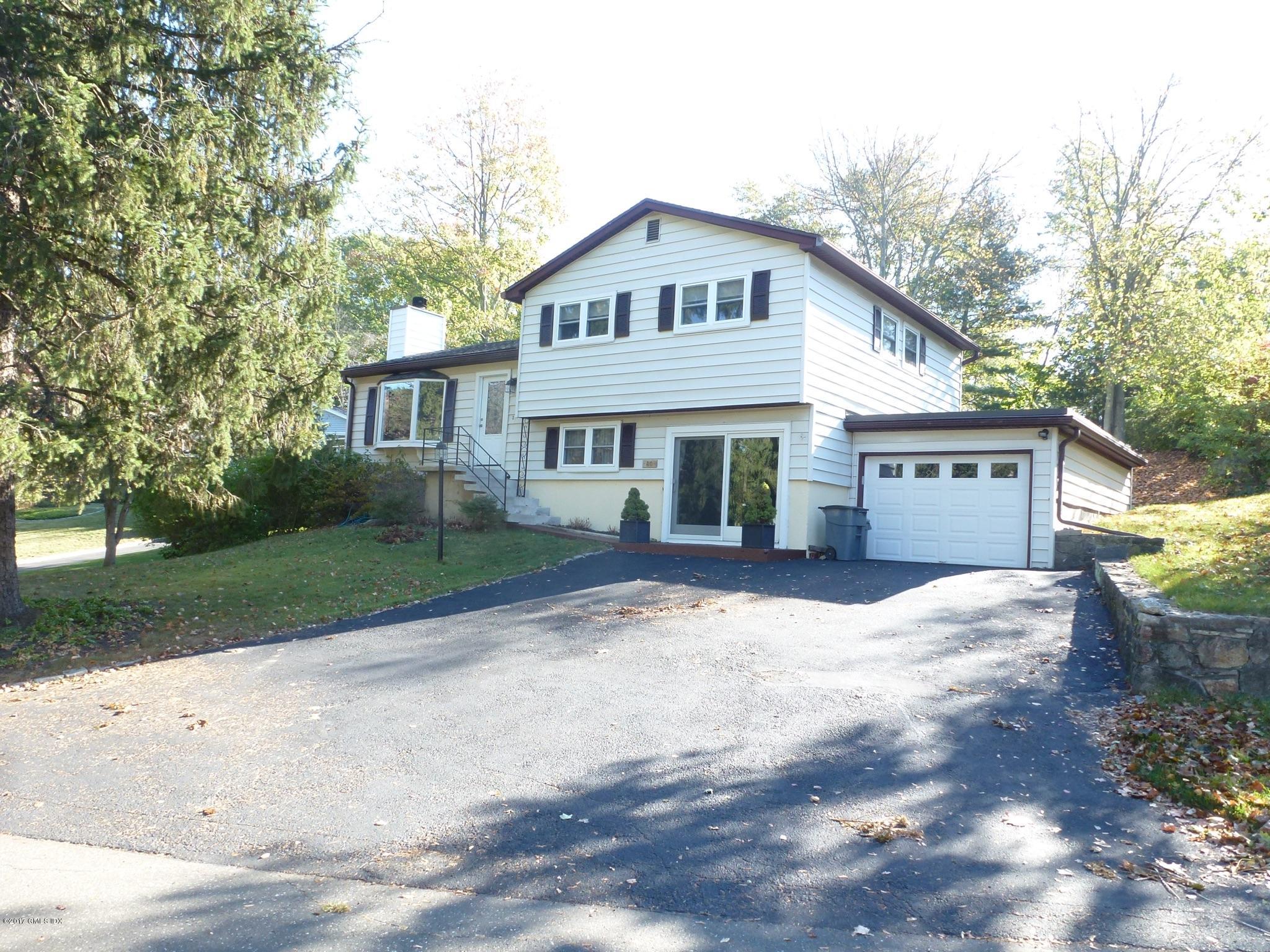 80 Mary Lane Riverside, CT 06878 - Photo 1 of 15 a view of a house with a yard and large tree