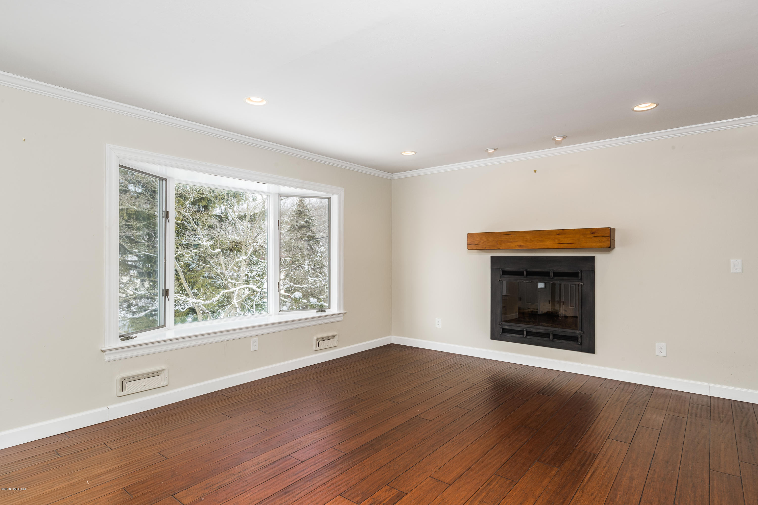 80 Mary Lane Riverside, CT 06878 - Photo 2 of 15 an empty room with wooden floor and a window