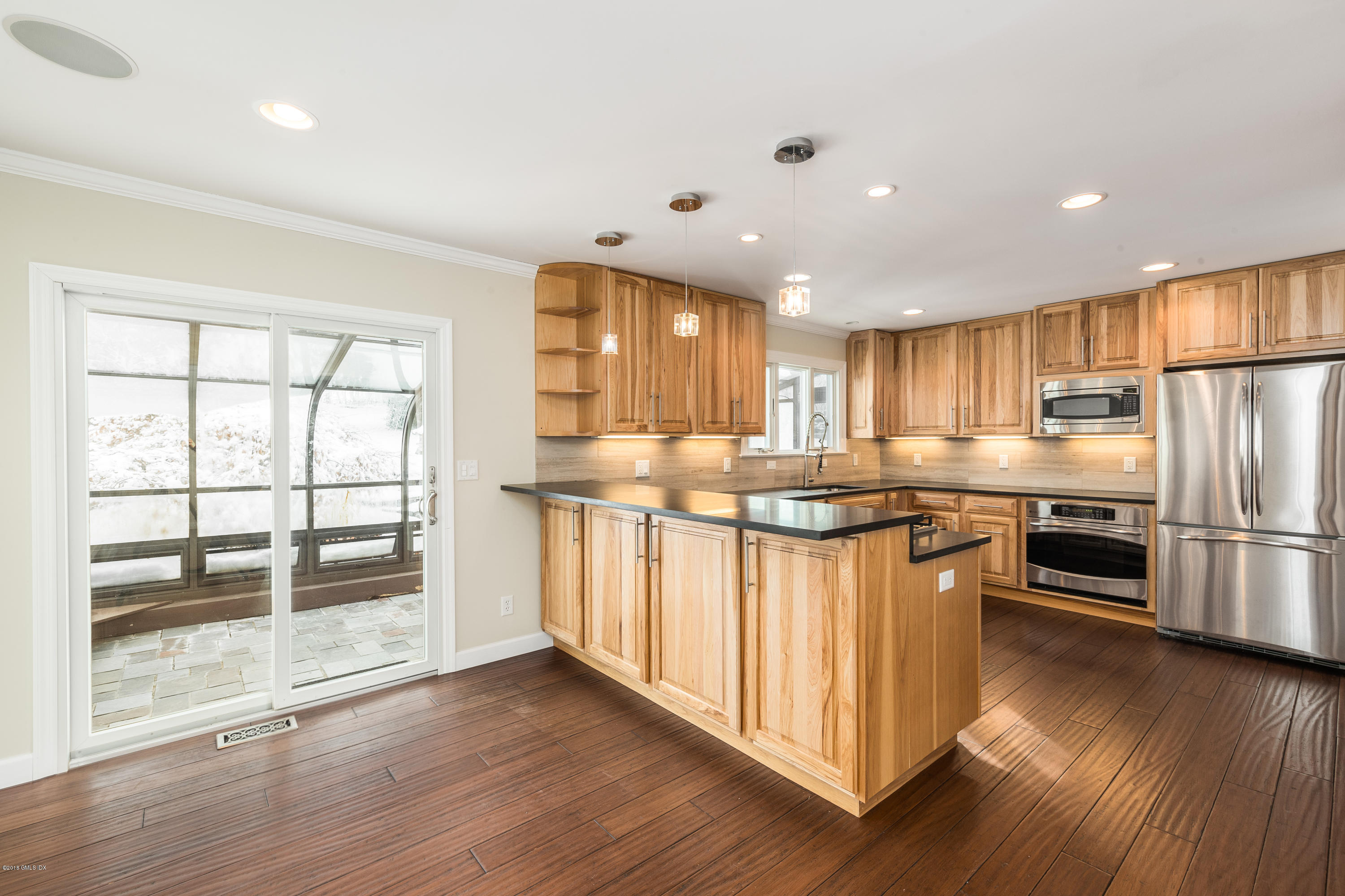 80 Mary Lane Riverside, CT 06878 - Photo 5 of 15 a kitchen with stainless steel appliances granite countertop a refrigerator a sink dishwasher a stove and a refrigerator with wooden floor