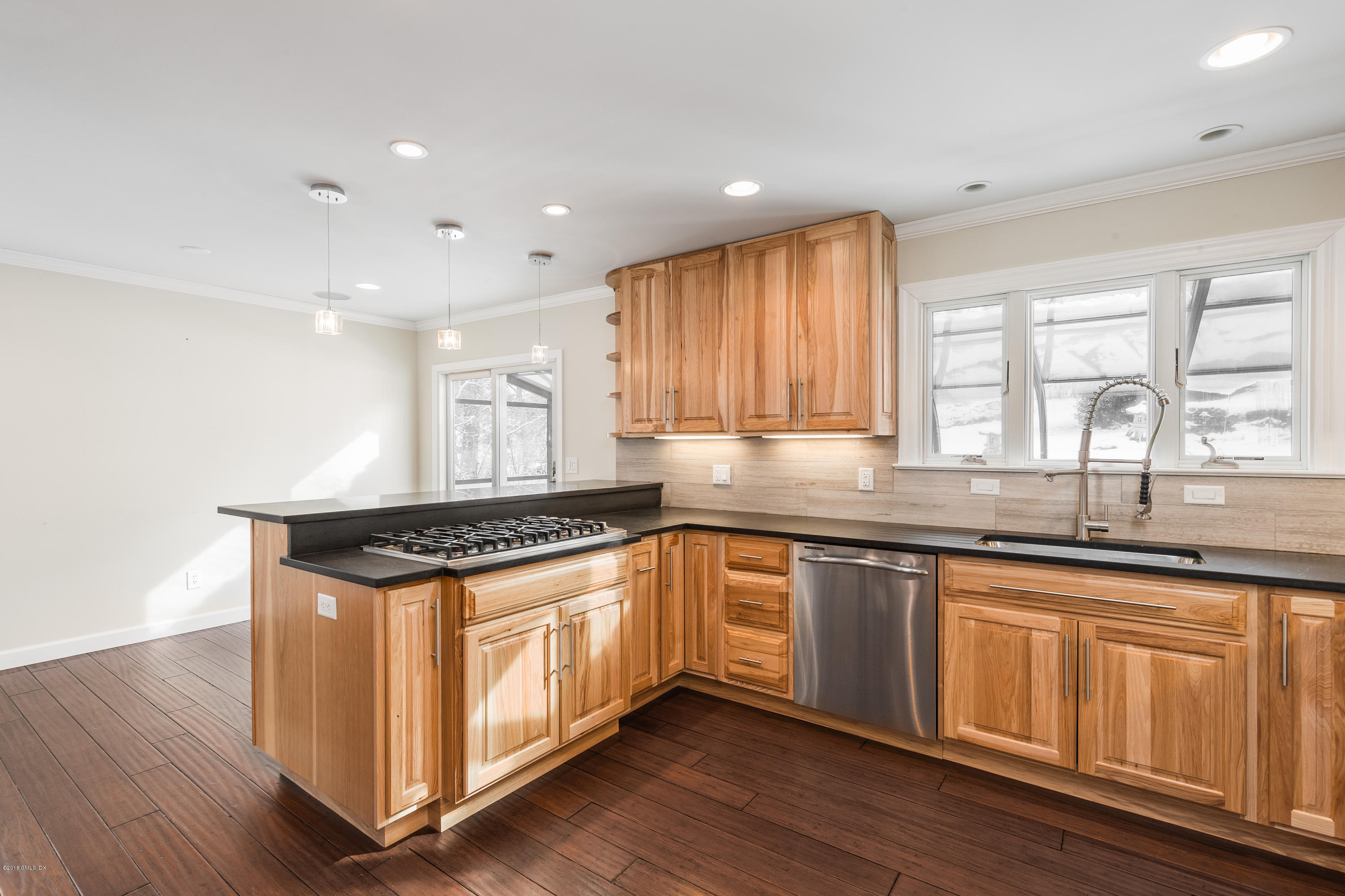 80 Mary Lane Riverside, CT 06878 - Photo 6 of 15 a kitchen with granite countertop wooden cabinets and a sink
