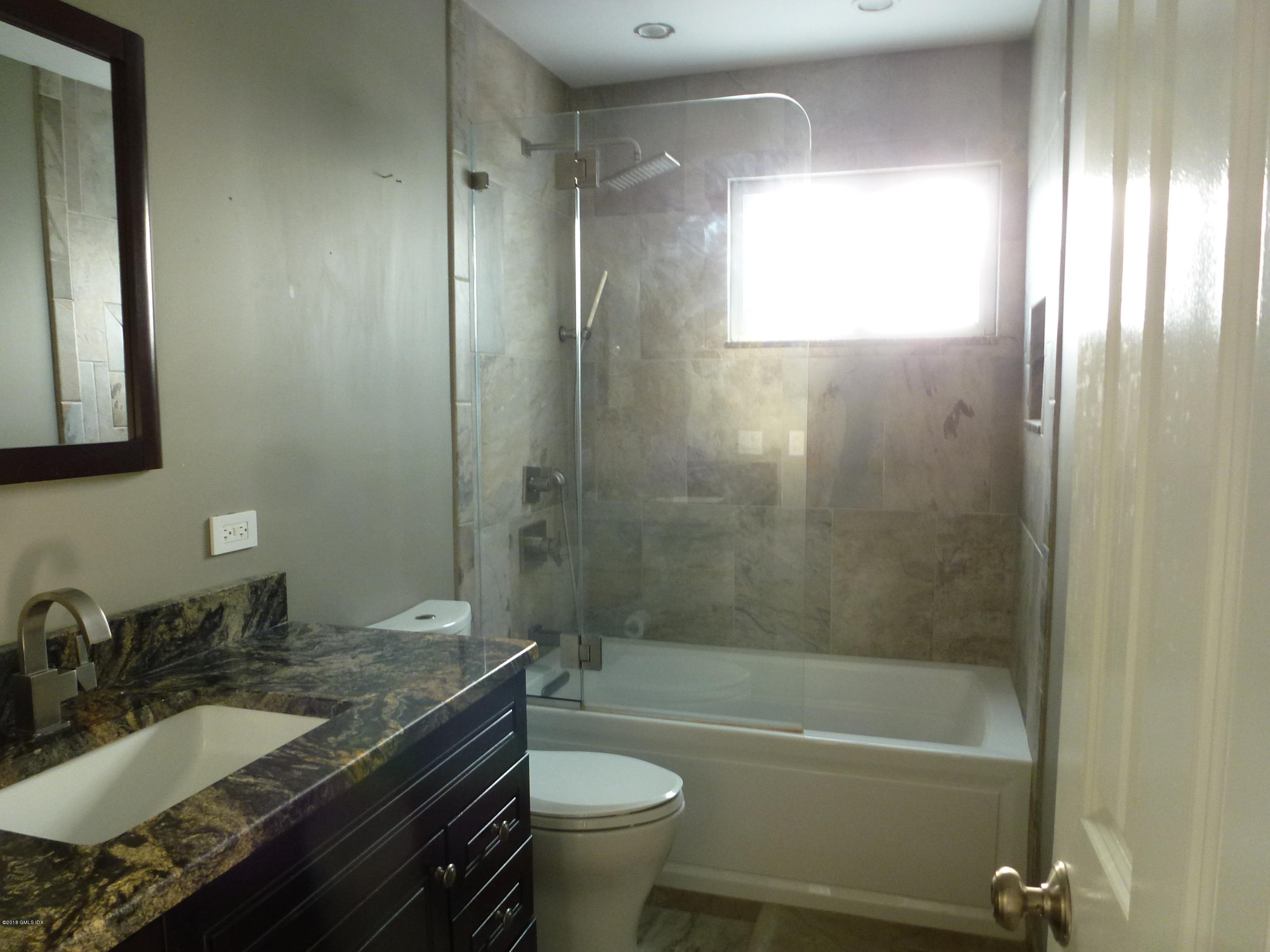 80 Mary Lane Riverside, CT 06878 - Photo 8 of 15 a bathroom with a granite countertop sink toilet and shower