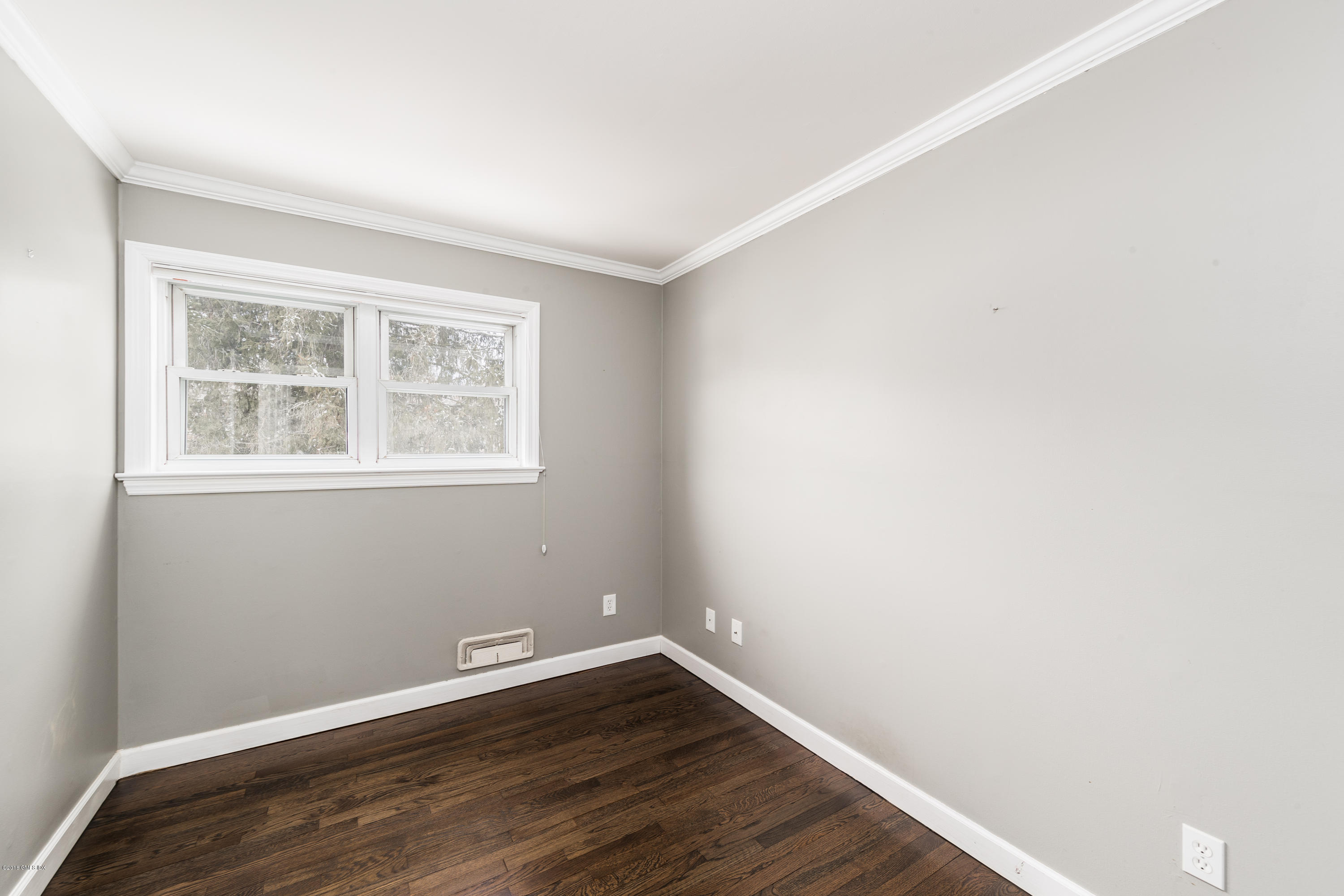 80 Mary Lane Riverside, CT 06878 - Photo 10 of 15 an empty room with wooden floor and windows