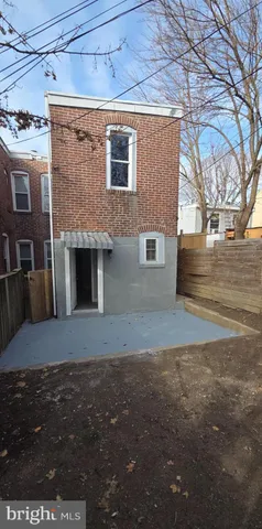 a brick house with a yard