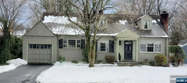 a front view of a house with yard