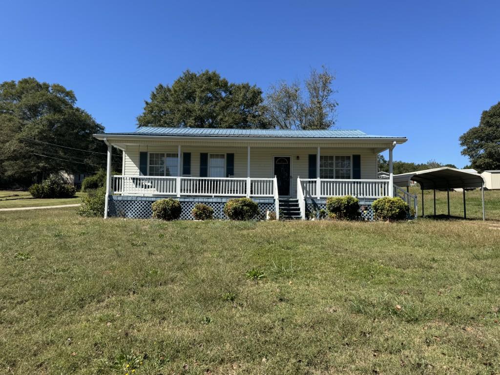 400 Shirley Road Royston, GA 30662 - Photo 1 of 1 a front view of a house with a yard