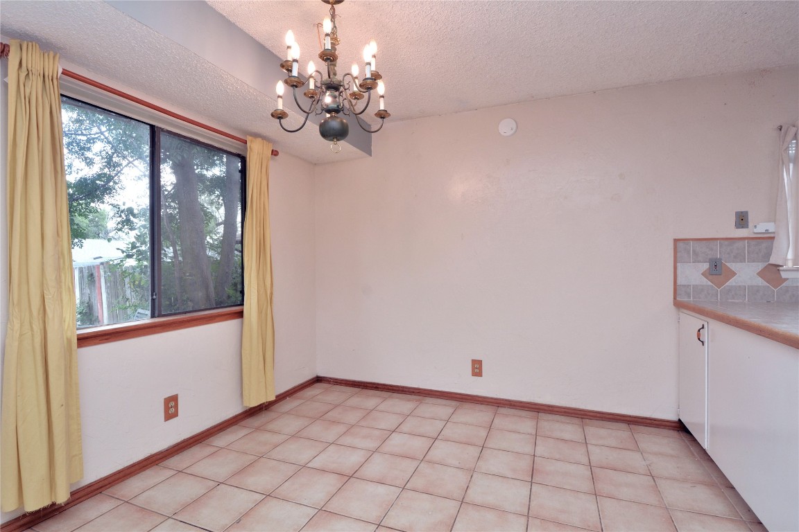 12327 Deerbrook Trail Austin, TX 78750 - Photo 6 of 20 a view of an empty room with a window