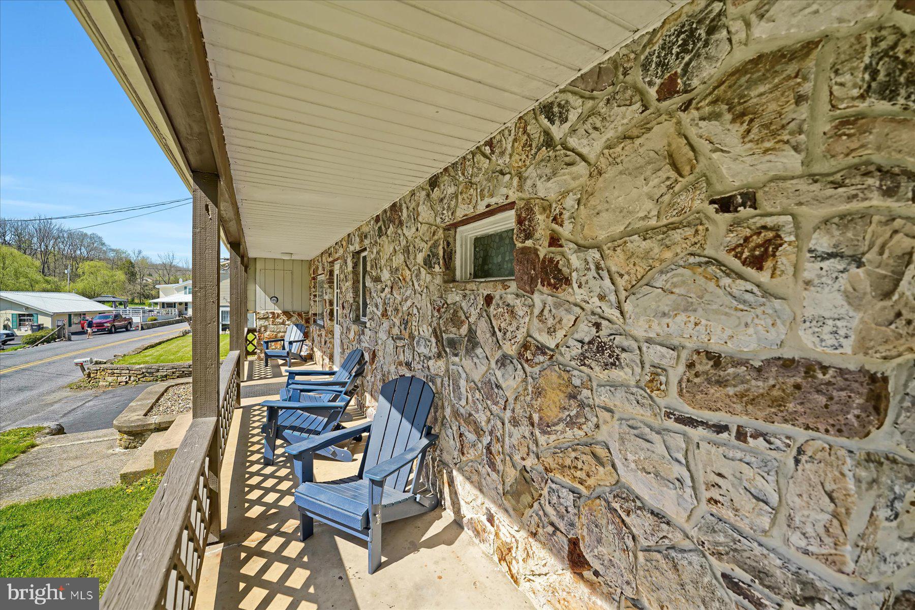 345 Spring Creek Road Bellefonte, PA 16823 - Photo 3 of 45 Charming stone porch with serene views.