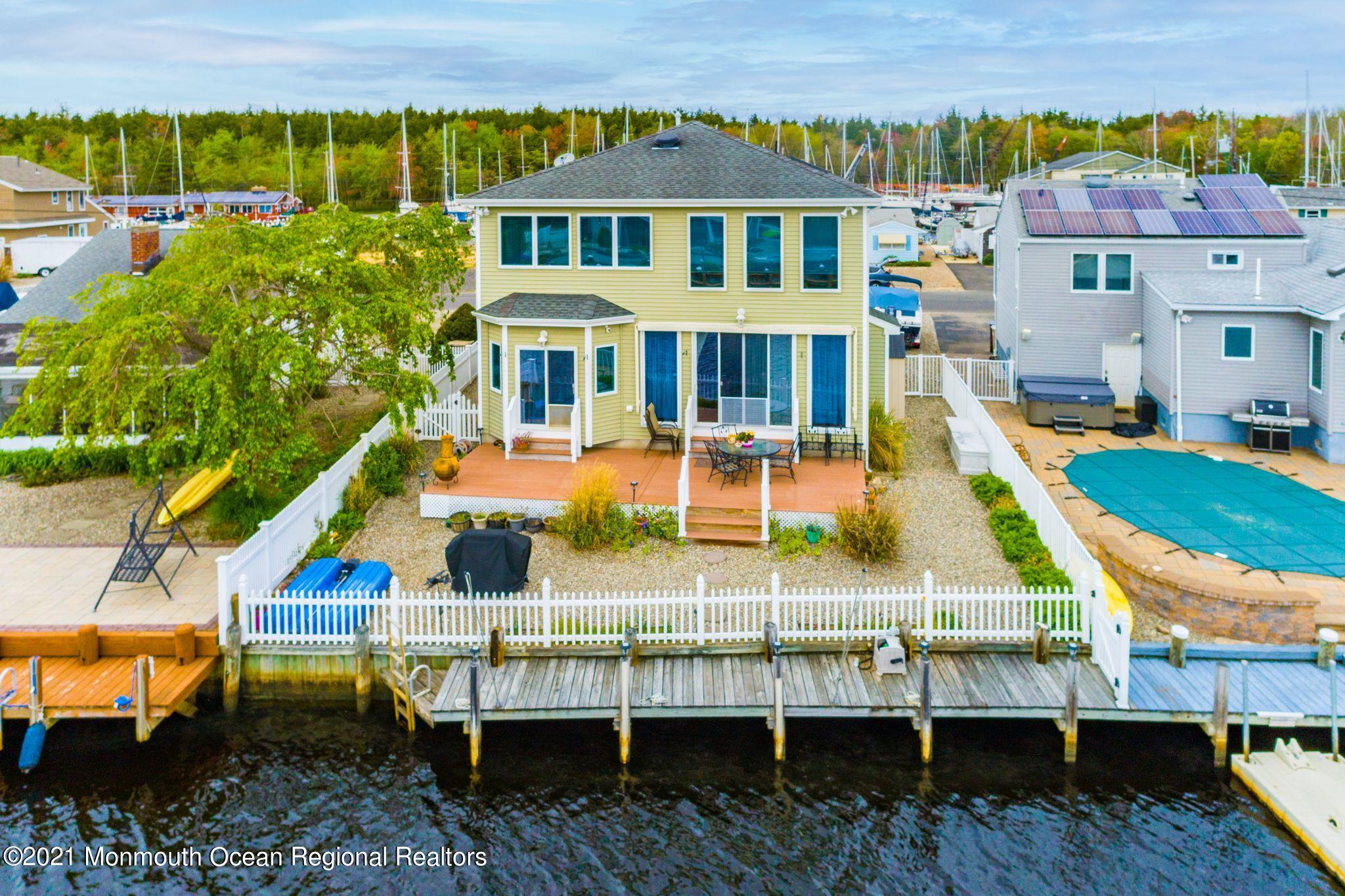 94 Cedar Run Road Bayville, NJ 08721 - Photo 2 of 43 an aerial view of a house with a yard