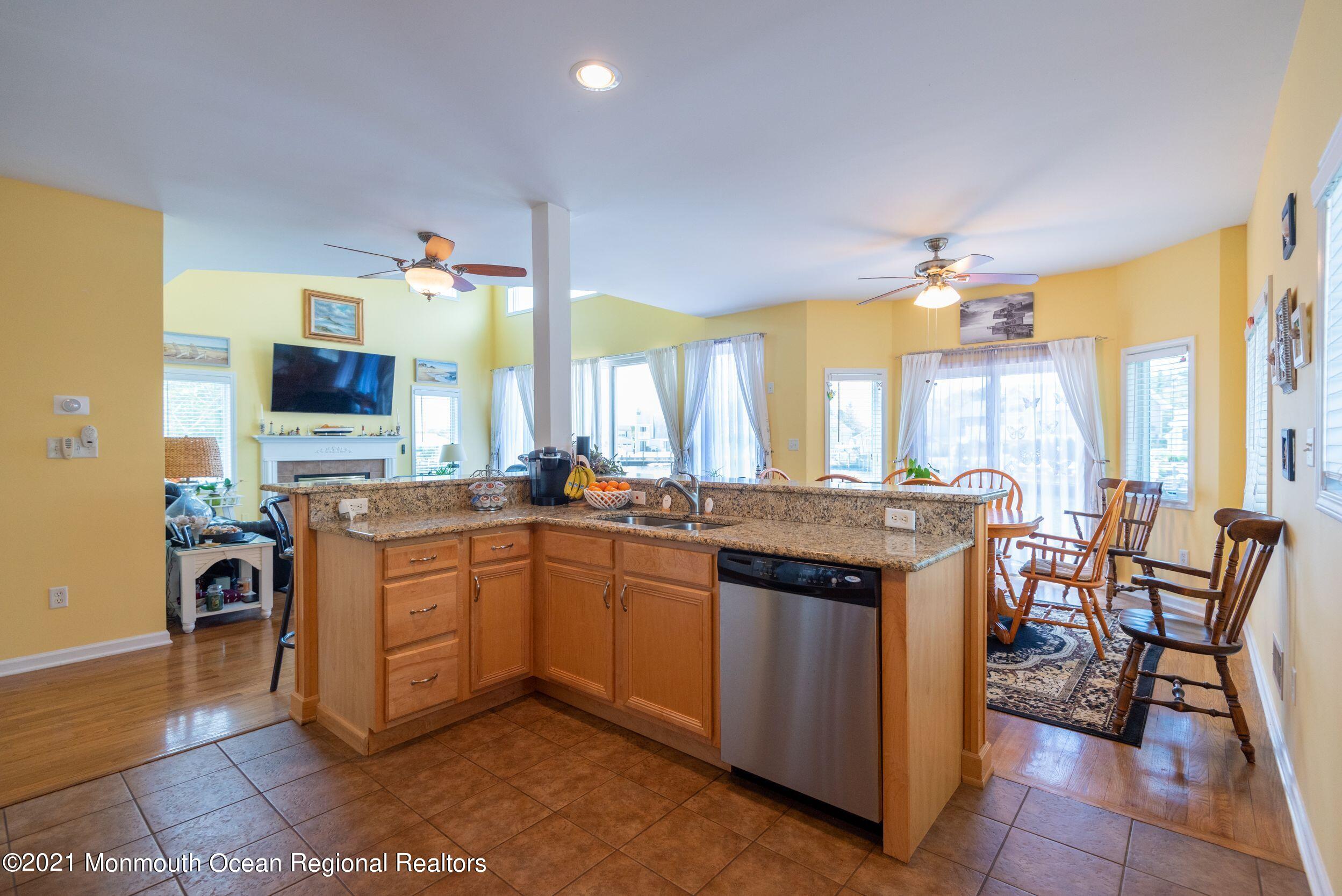 94 Cedar Run Road Bayville, NJ 08721 - Photo 12 of 43 a kitchen with stainless steel appliances granite countertop a stove and a refrigerator