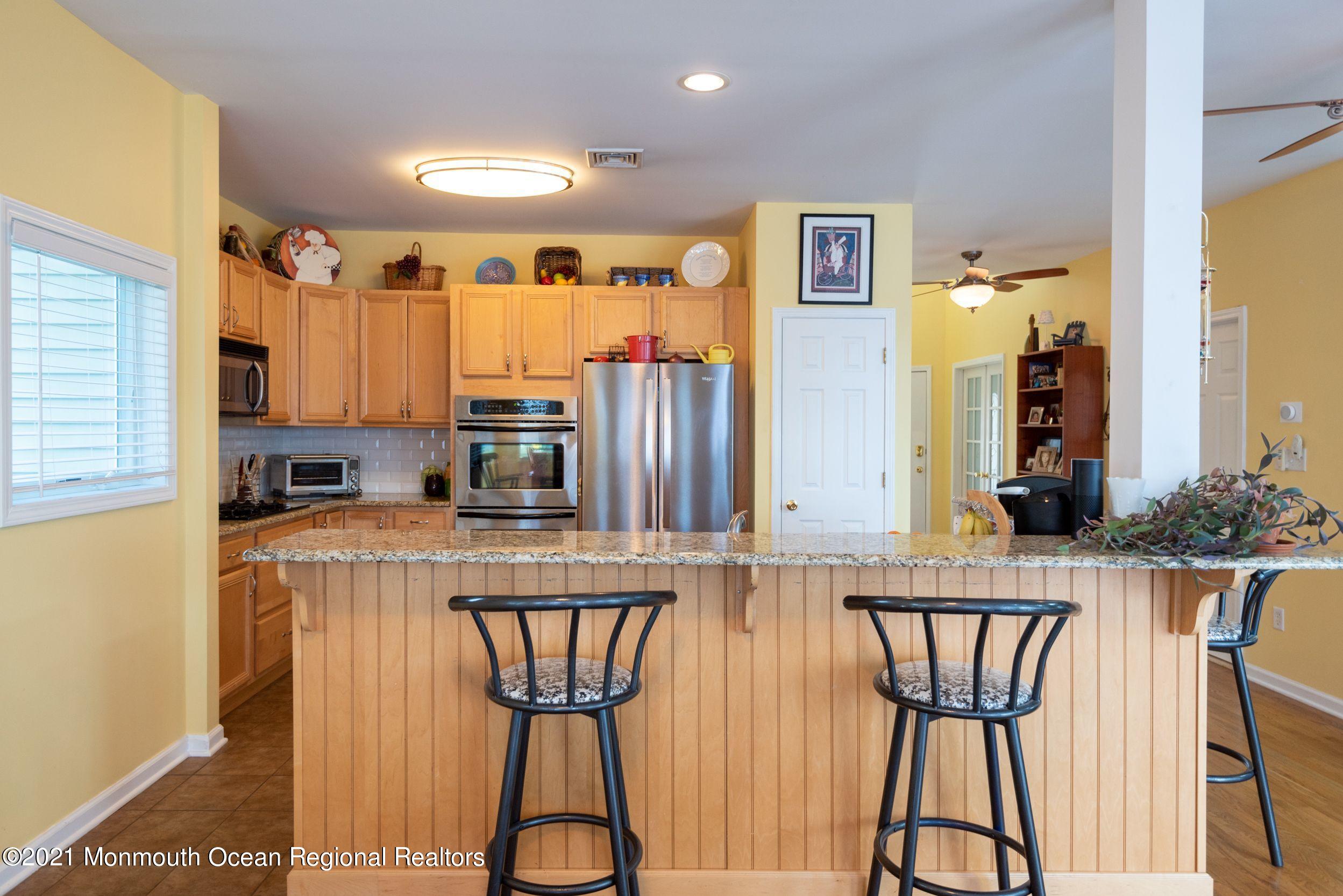 94 Cedar Run Road Bayville, NJ 08721 - Photo 14 of 43 a kitchen with stainless steel appliances a microwave a stove and refrigerator