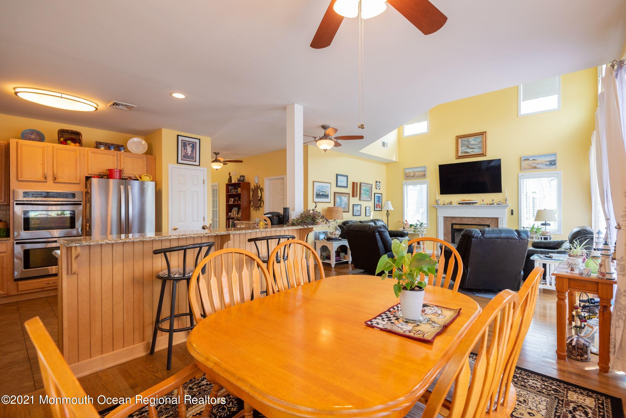 94 Cedar Run Road Bayville, NJ 08721 - Photo 17 of 43 a view of a dining room with furniture window and wooden floor