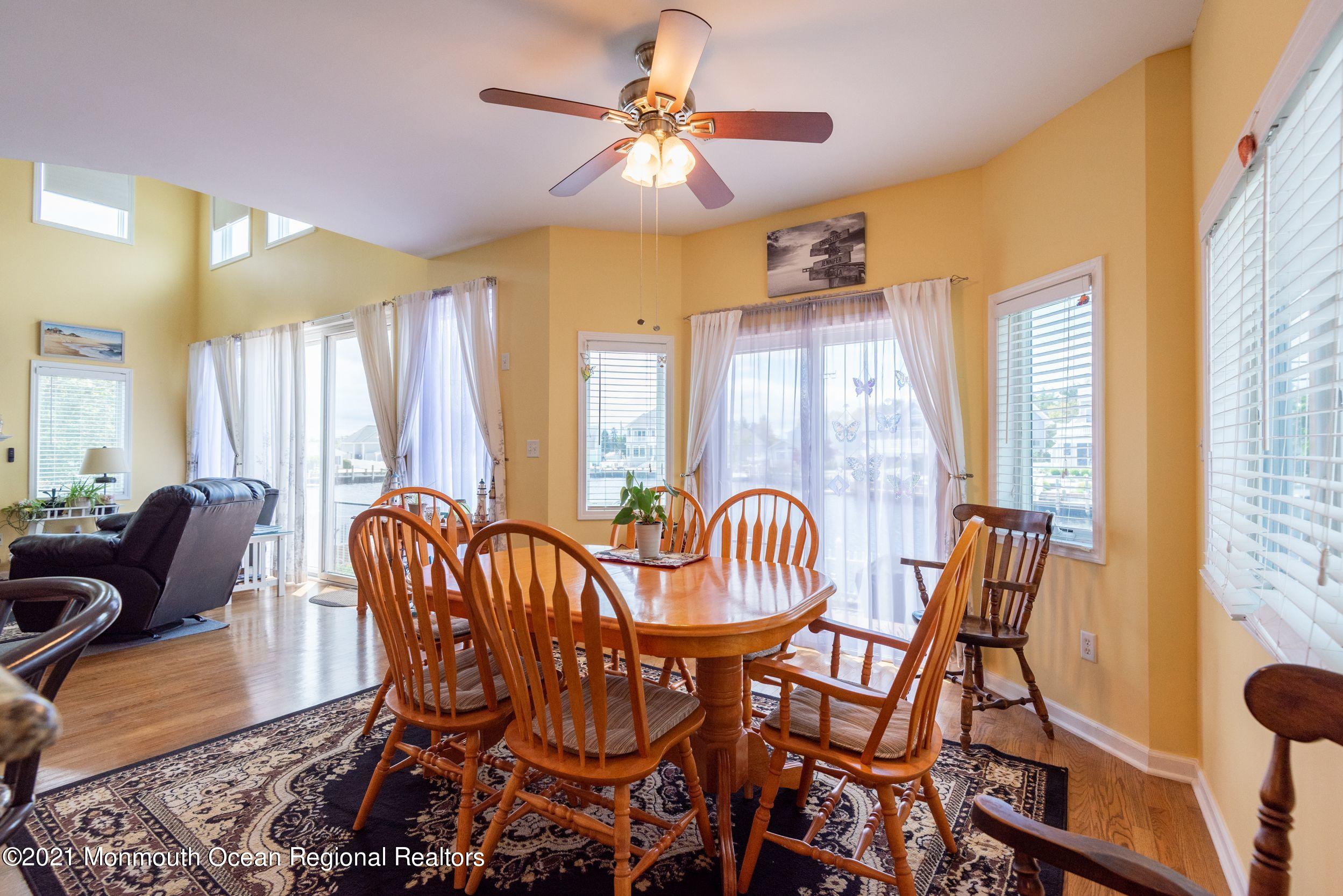 94 Cedar Run Road Bayville, NJ 08721 - Photo 19 of 43 a view of a dining room with furniture and windows