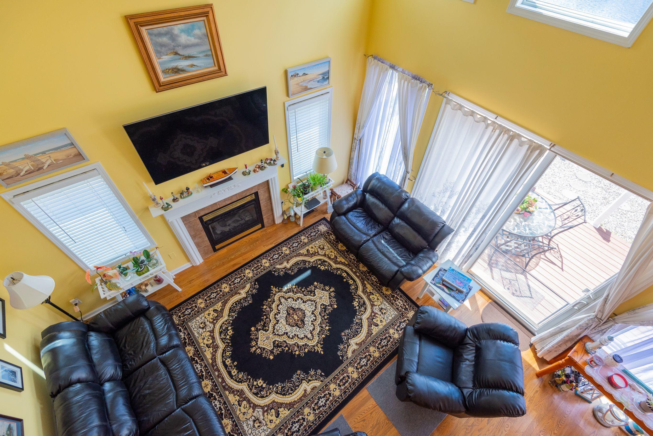 94 Cedar Run Road Bayville, NJ 08721 - Photo 22 of 43 a living room with furniture and a flat screen tv
