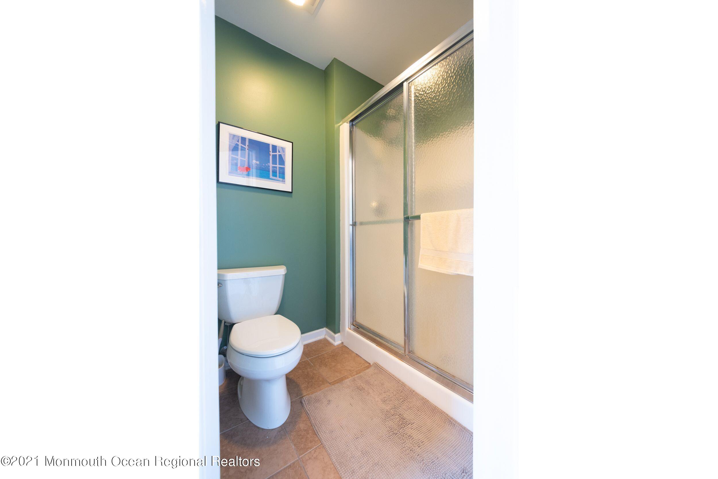 94 Cedar Run Road Bayville, NJ 08721 - Photo 27 of 43 a bathroom with a toilet and a shower