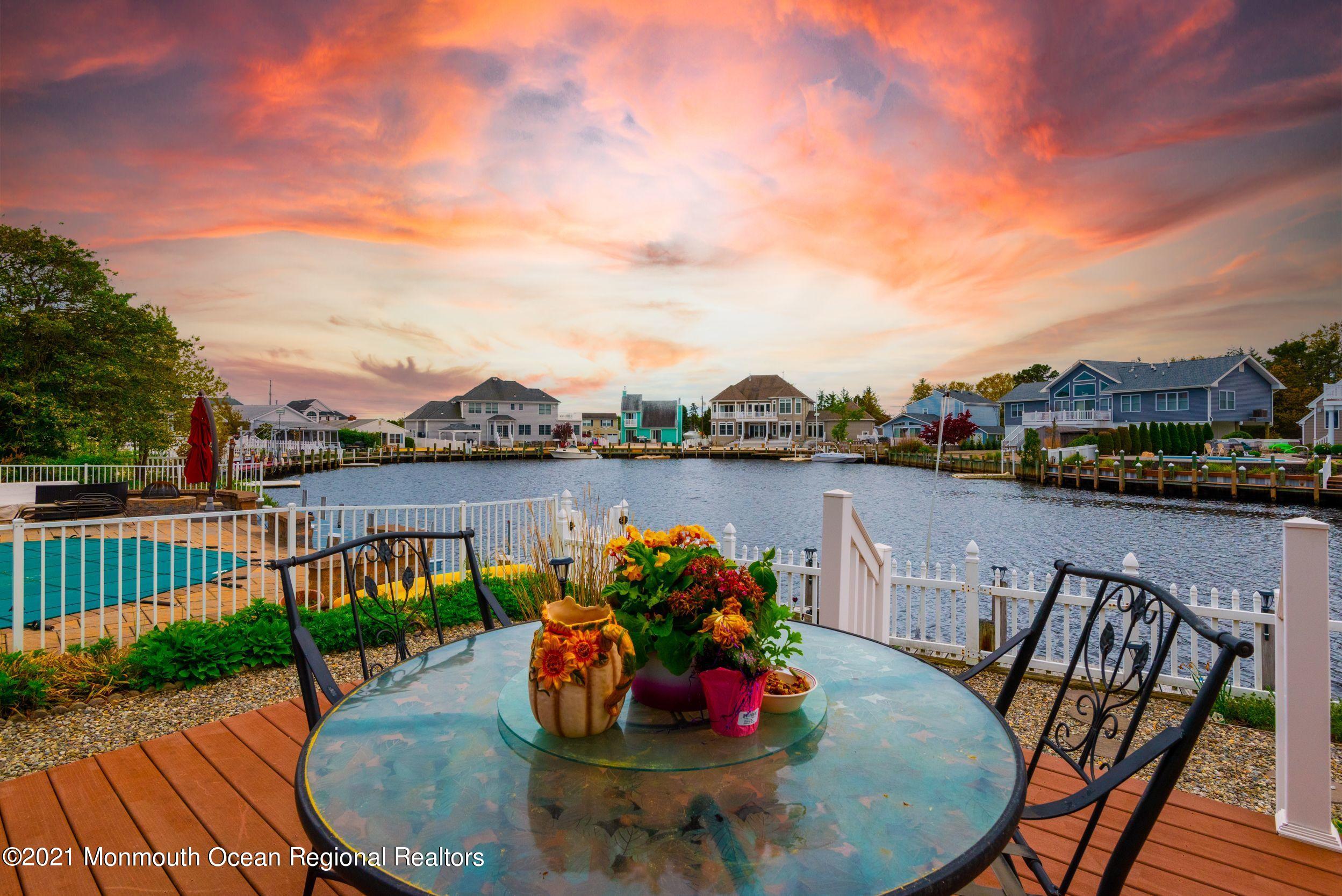 94 Cedar Run Road Bayville, NJ 08721 - Photo 32 of 43 a view of a chairs and table in patio