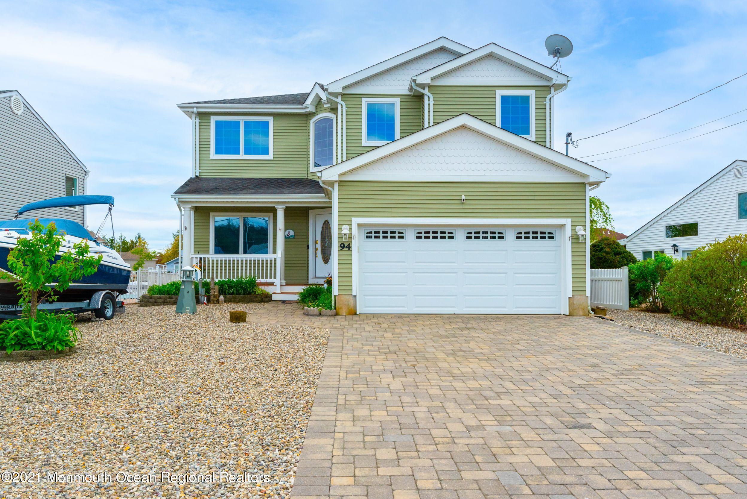 94 Cedar Run Road Bayville, NJ 08721 - Photo 43 of 43 a view of a house with a yard and potted plants
