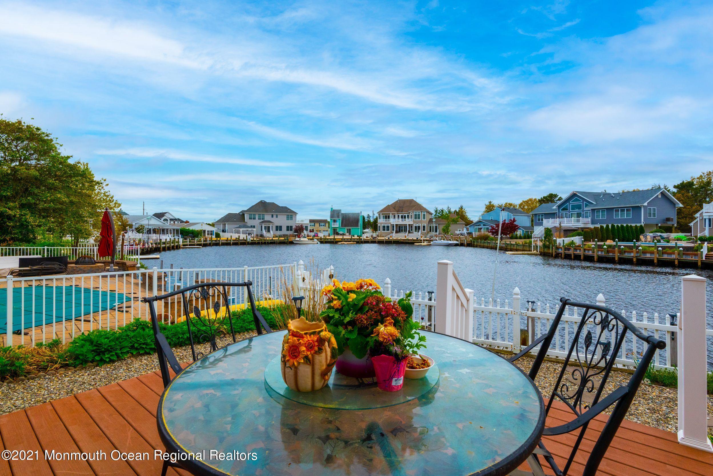 94 Cedar Run Road Bayville, NJ 08721 - Photo 8 of 43 a view of a chairs and table in patio