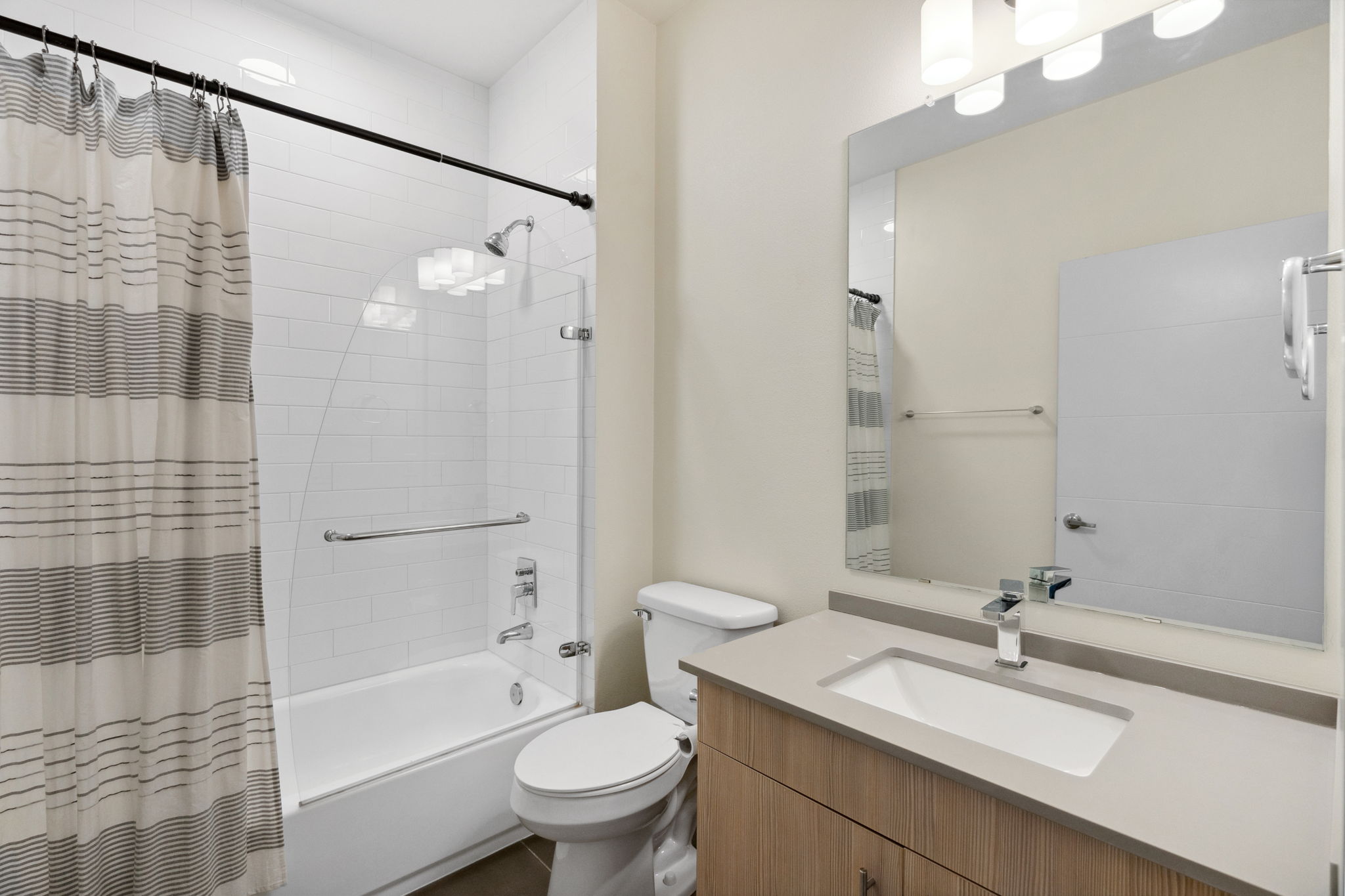 7805 Cooper Lane, Unit 606 Austin, TX 78745 - Photo 25 of 35 a bathroom with a sink toilet and shower