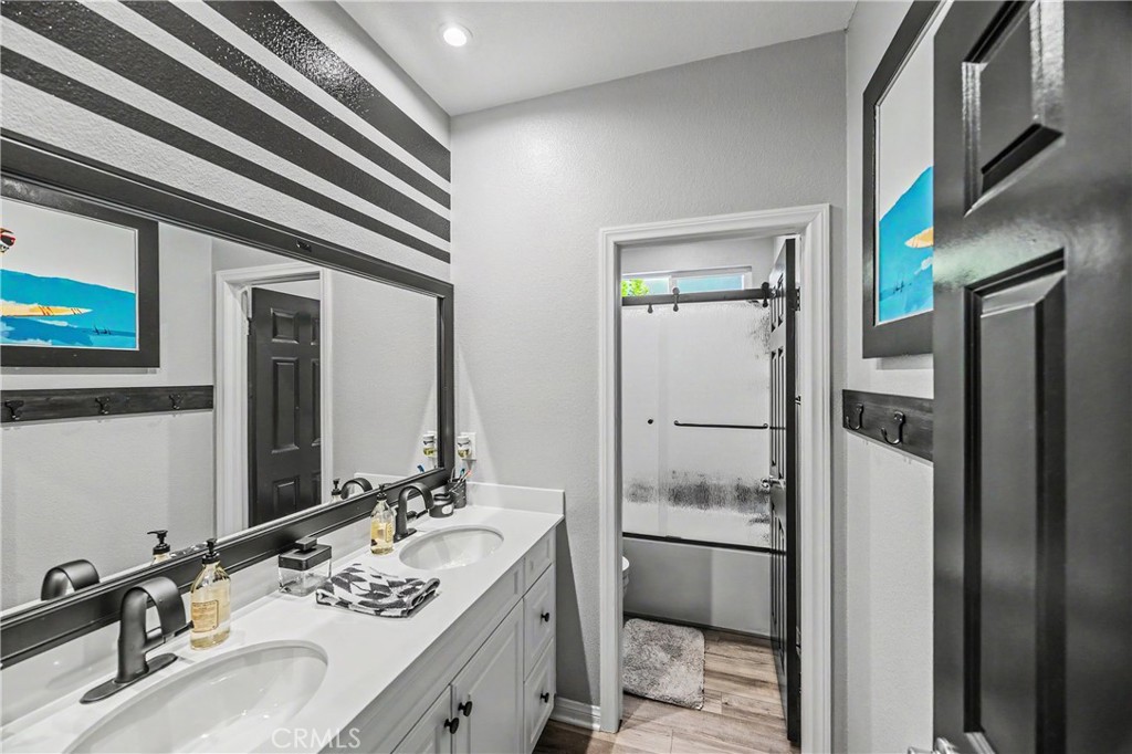 34512 Burnt Pine Road Murrieta, CA 92563 - Photo 10 of 21 a bathroom with a sink and a mirror