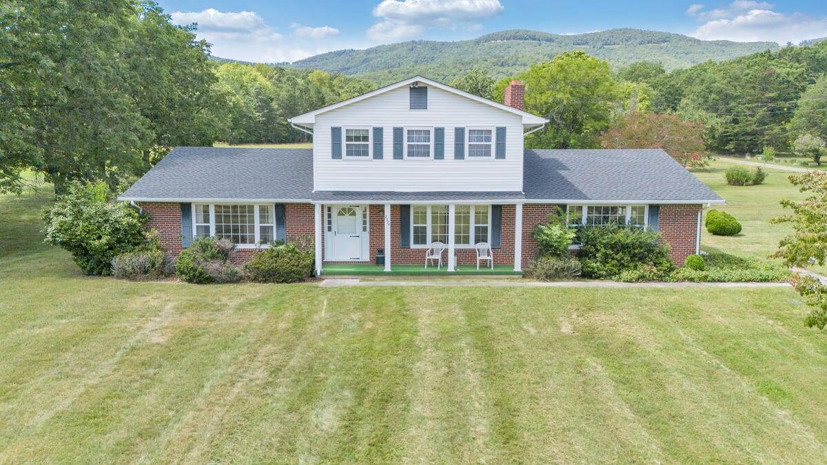 2324 Camp Jaycee Road Blue Ridge, VA 24064 - Photo 1 of 74 a front view of a house with a yard and garage