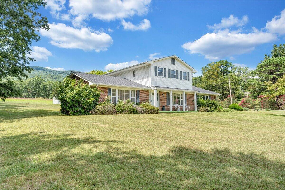 2324 Camp Jaycee Road Blue Ridge, VA 24064 - Photo 56 of 74 a front view of a house with a garden