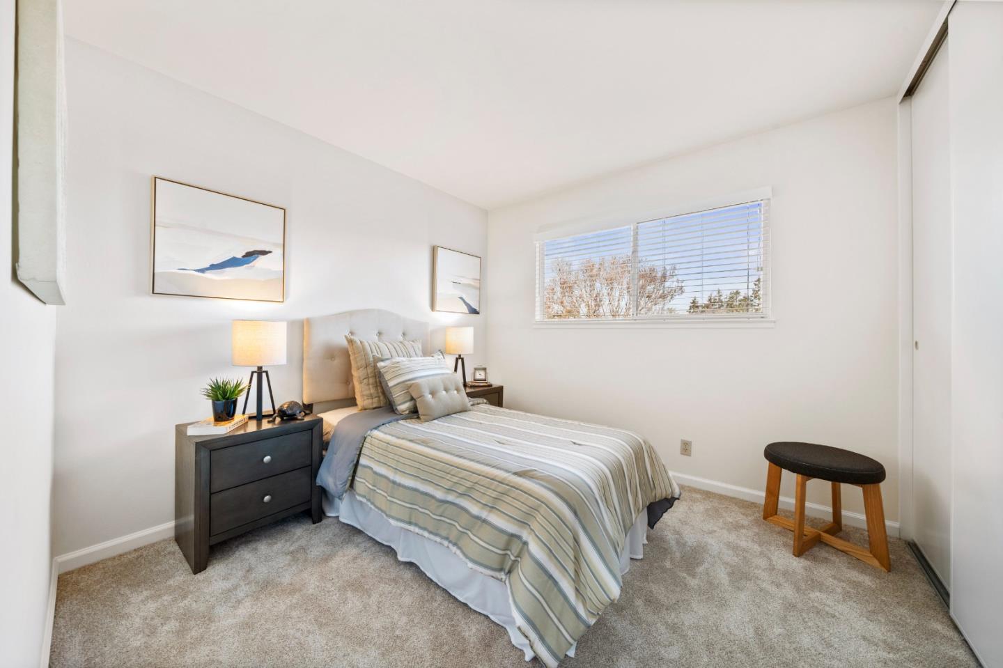 1574 Bittern Drive Sunnyvale, CA 94087 - Photo 18 of 36 a bedroom with a bed and a chair