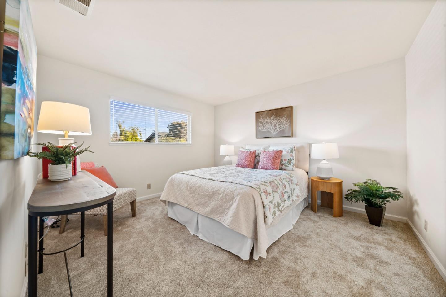 1574 Bittern Drive Sunnyvale, CA 94087 - Photo 21 of 36 a bedroom with a bed a table and painting on the wall