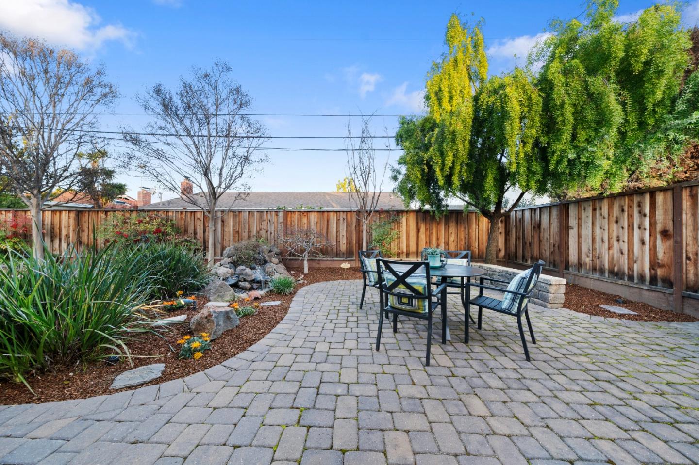 1574 Bittern Drive Sunnyvale, CA 94087 - Photo 29 of 36 a view of a patio with table and chairs and wooden fence
