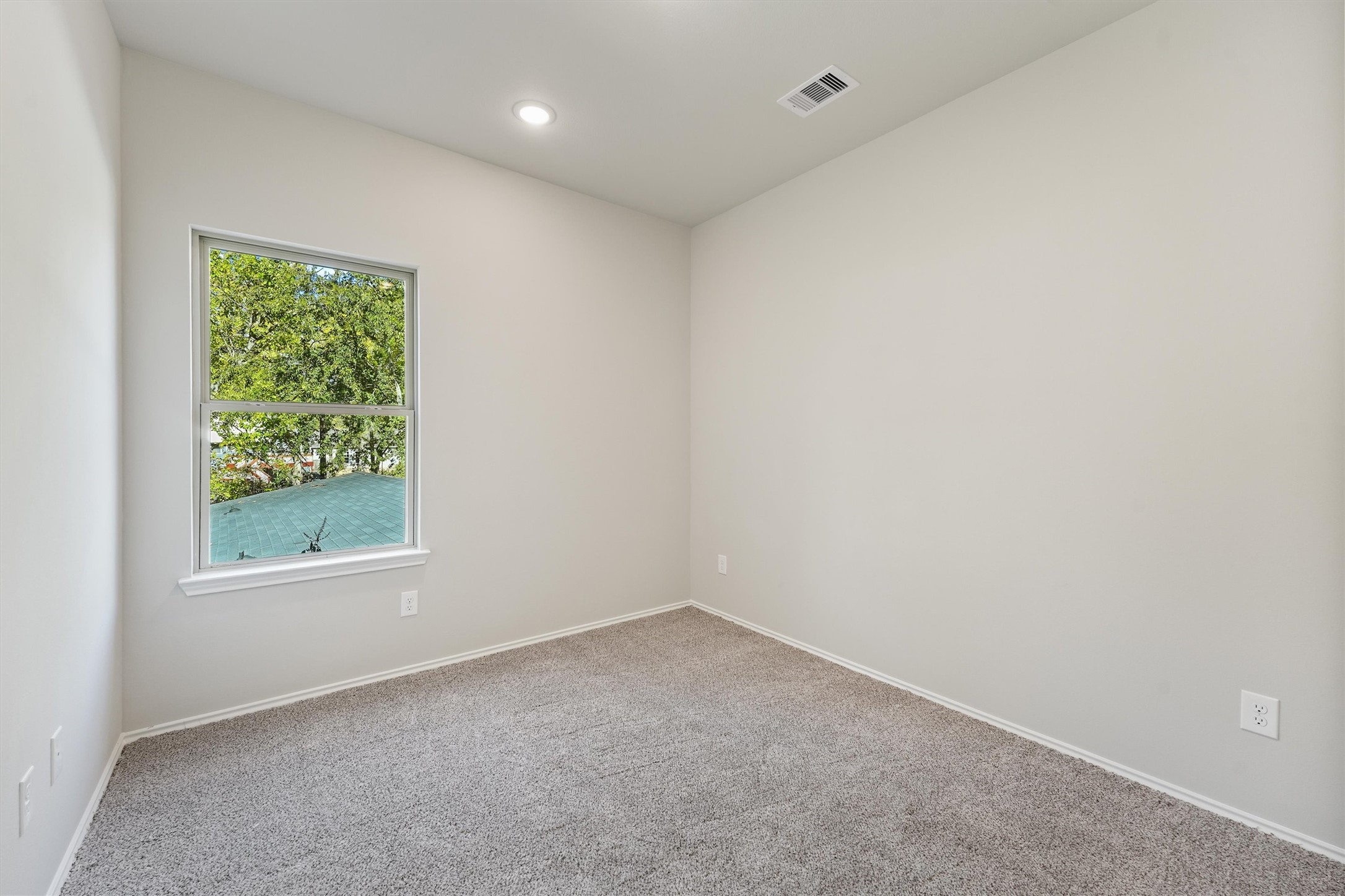 8687 Sassafras Willis, TX 77318 - Photo 19 of 32 an empty room with a window
