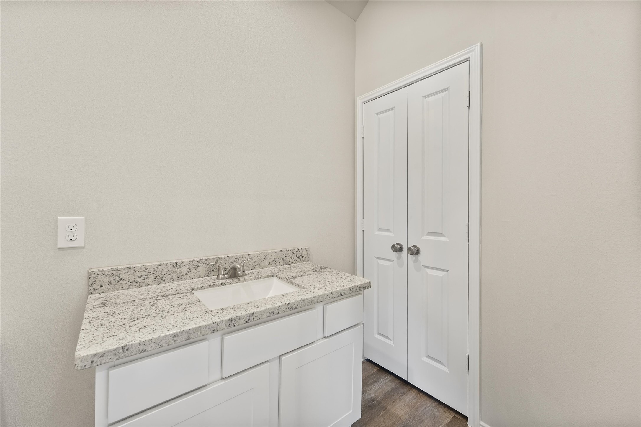 8687 Sassafras Willis, TX 77318 - Photo 24 of 32 a bathroom with a granite countertop sink and a mirror