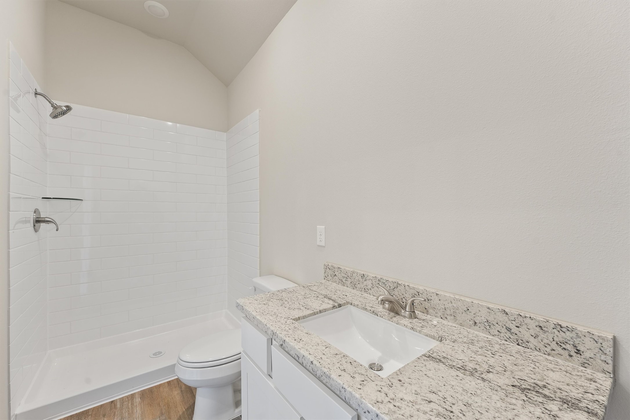8687 Sassafras Willis, TX 77318 - Photo 25 of 32 a bathroom with a granite countertop sink toilet and shower