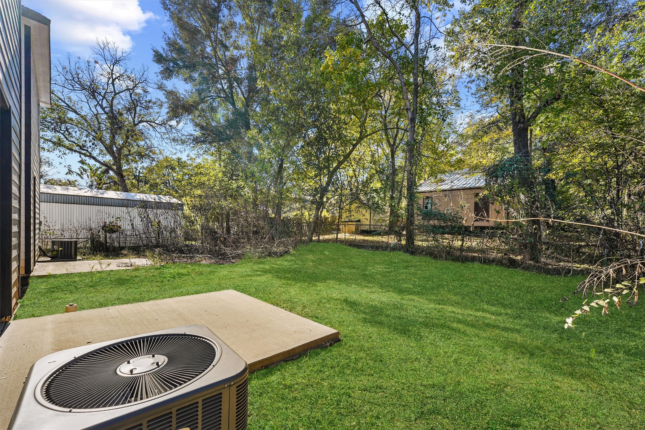 8687 Sassafras Willis, TX 77318 - Photo 28 of 32 a view of an house with backyard space and garden