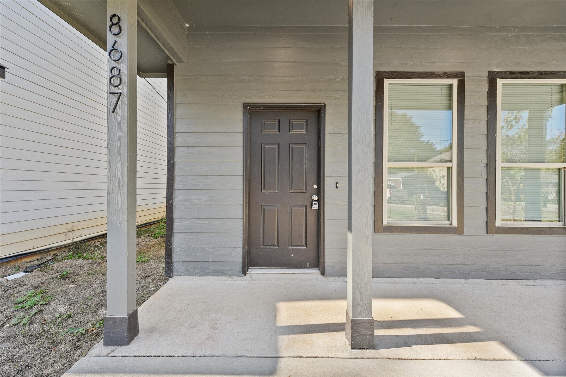 8687 Sassafras Willis, TX 77318 - Photo 3 of 32 a front view of a house with a porch
