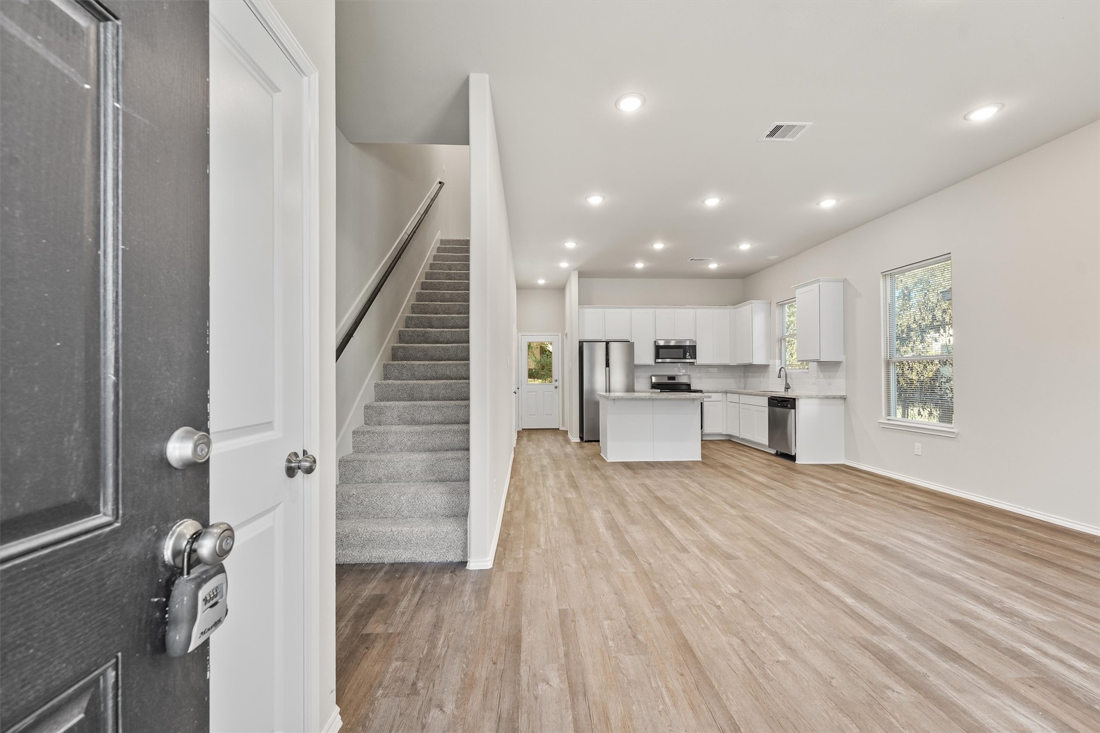 8687 Sassafras Willis, TX 77318 - Photo 4 of 32 a view of kitchen with furniture and wooden floor