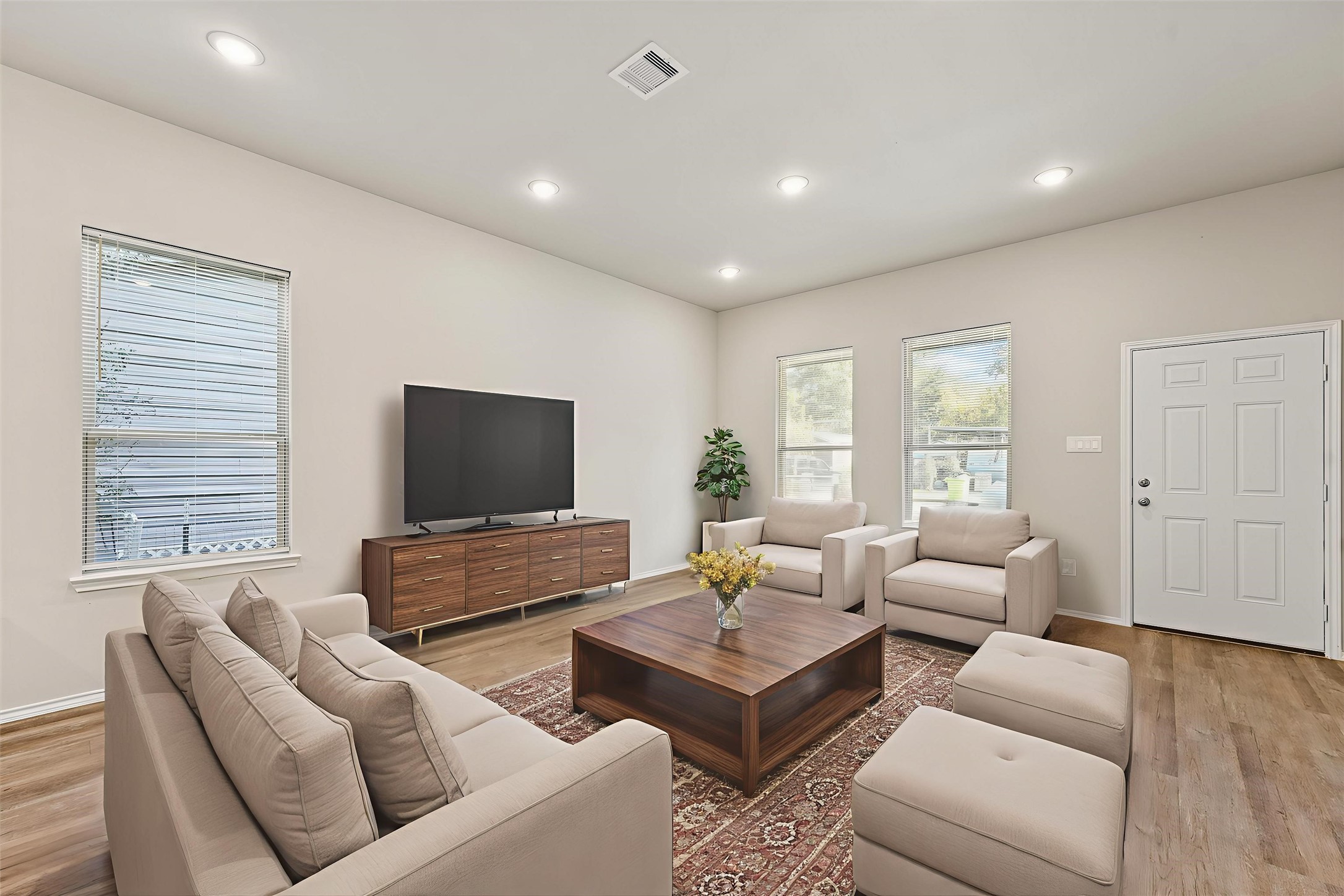8687 Sassafras Willis, TX 77318 - Photo 7 of 32 a living room with furniture and a flat screen tv