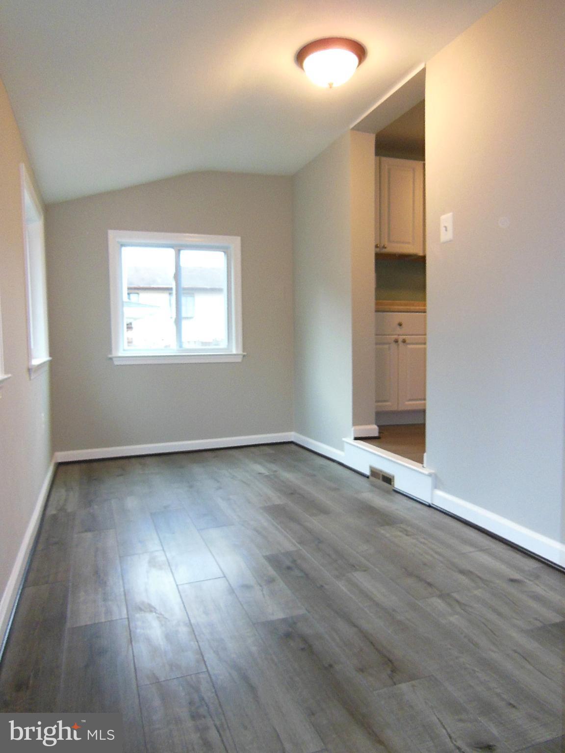 4813 Valley Forge Road Randallstown, MD 21133 - Photo 22 of 29 Sunroom has brand new laminate flooring