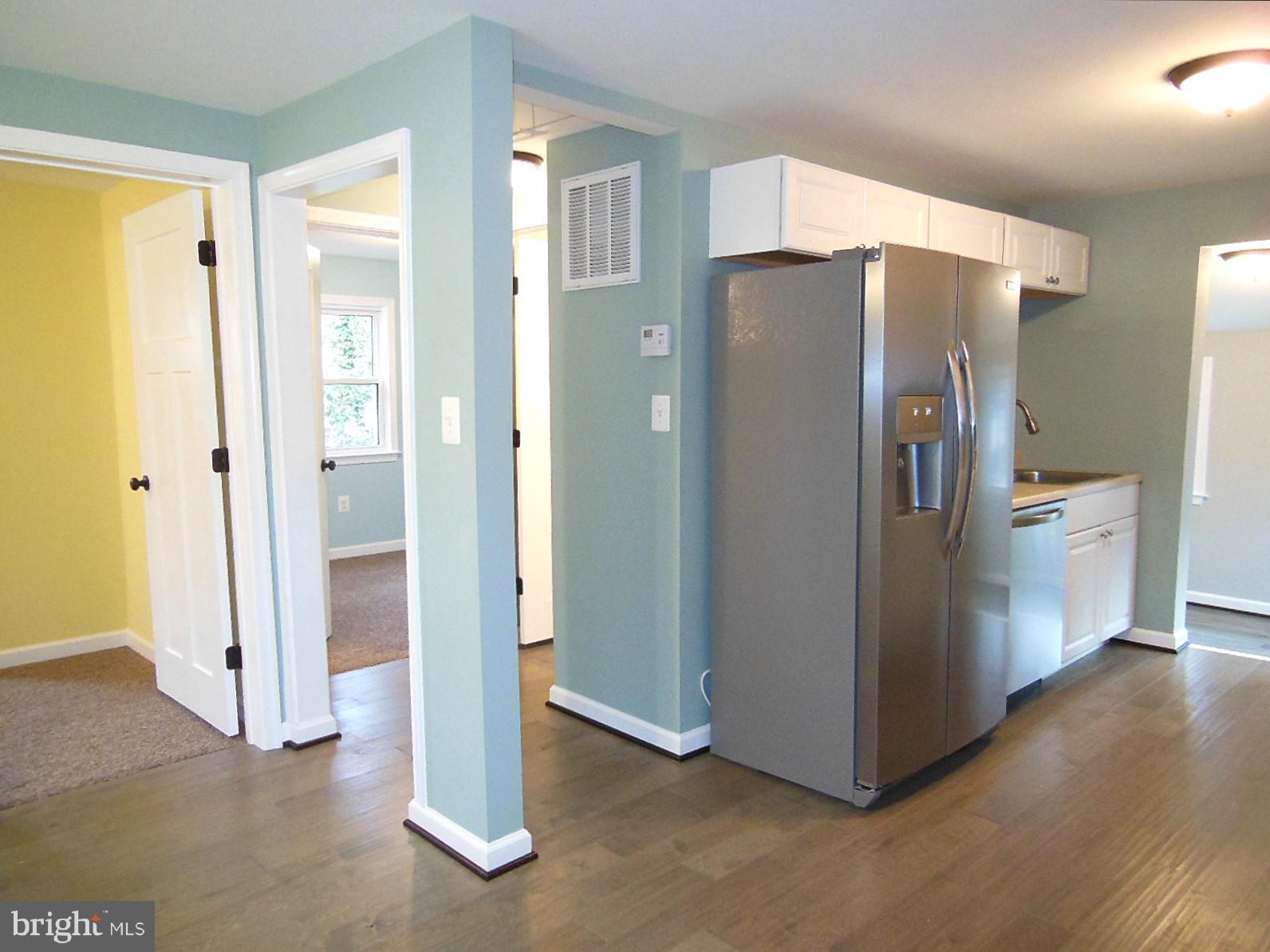 4813 Valley Forge Road Randallstown, MD 21133 - Photo 9 of 29 Kitchen has new engineered hardwood flooring