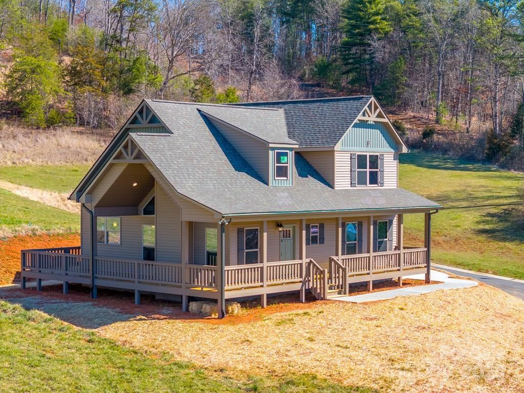 a house with tall trees in the background