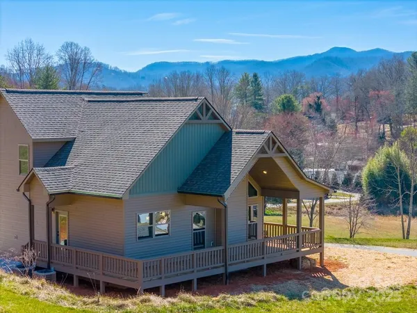 a aerial view of a house with a yard