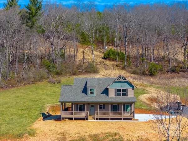 a aerial view of a house with a yard