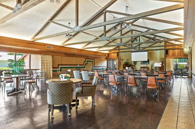 a dining room with lots of tables and chairs