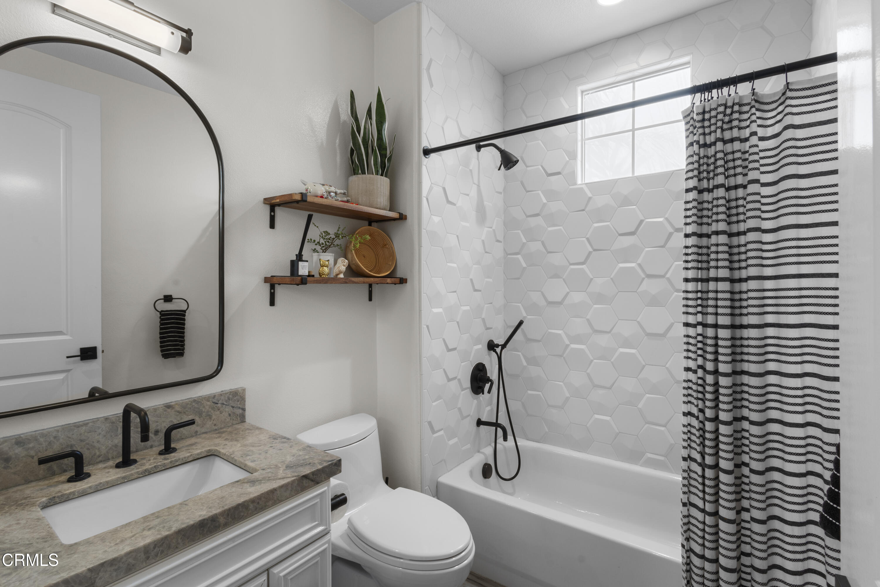 4173 Caribbean Street Oxnard, CA 93035 - Photo 16 of 64 a bathroom with a granite countertop sink toilet and shower