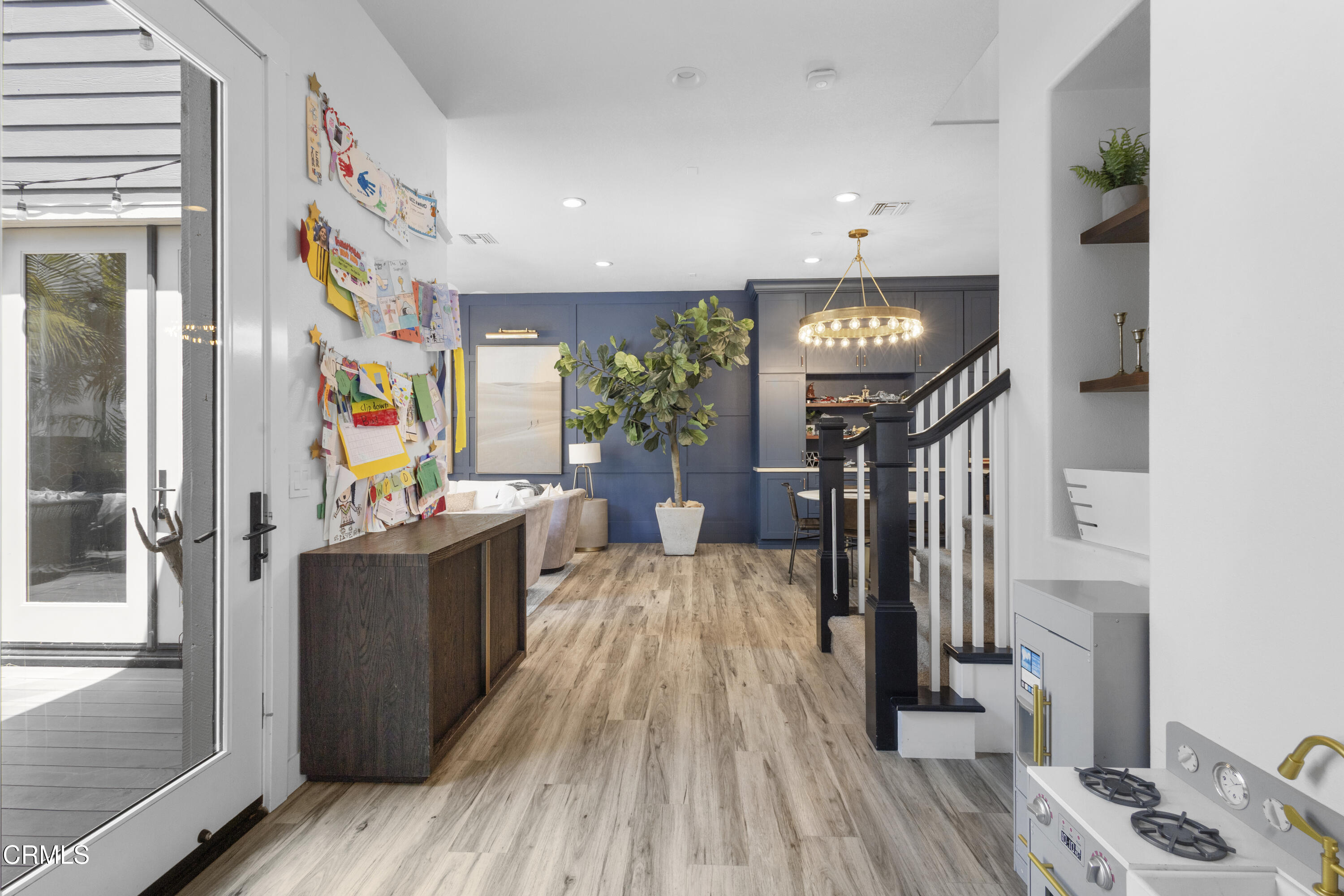 4173 Caribbean Street Oxnard, CA 93035 - Photo 17 of 64 a view of a hallway with furniture and wooden floor