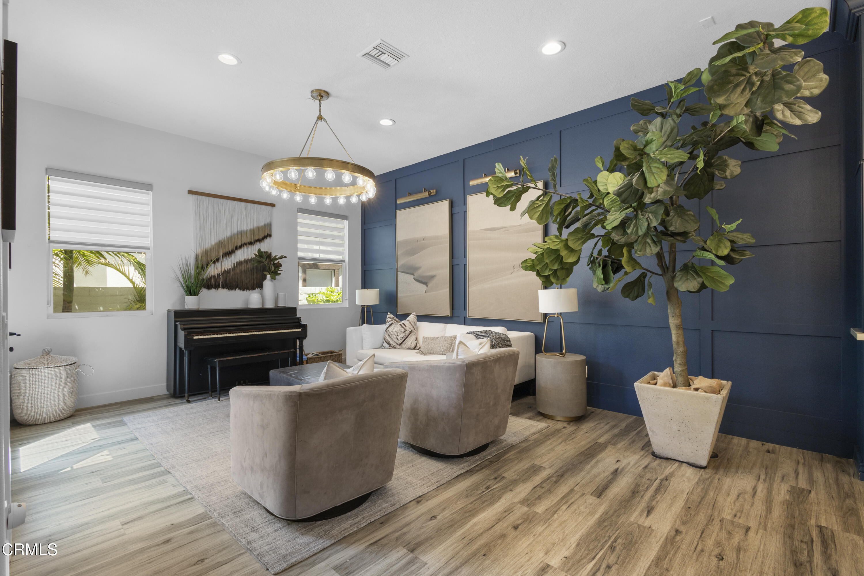 4173 Caribbean Street Oxnard, CA 93035 - Photo 18 of 64 a living room with furniture a chandelier and a potted plant