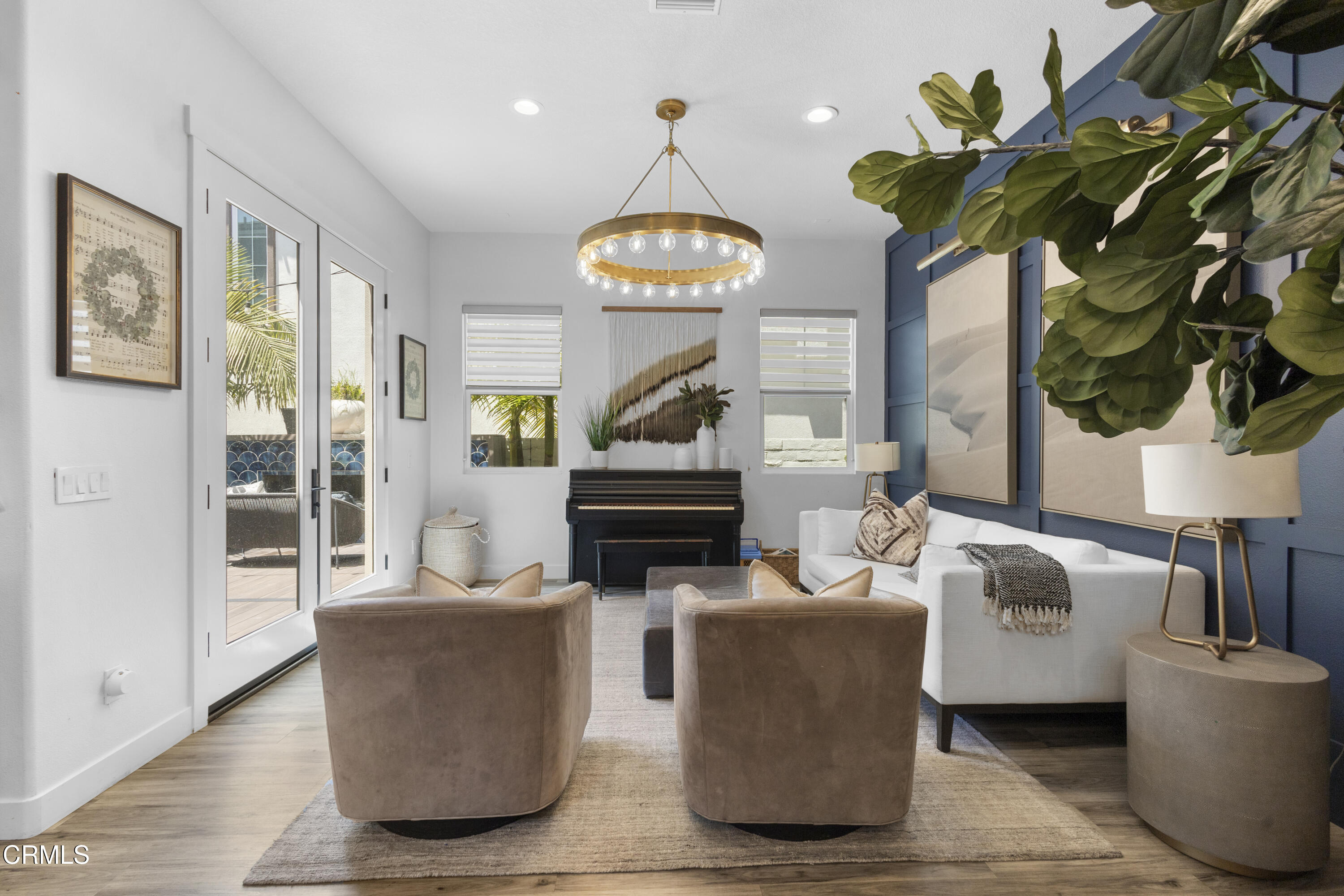 4173 Caribbean Street Oxnard, CA 93035 - Photo 20 of 64 a living room with fireplace furniture and a chandelier