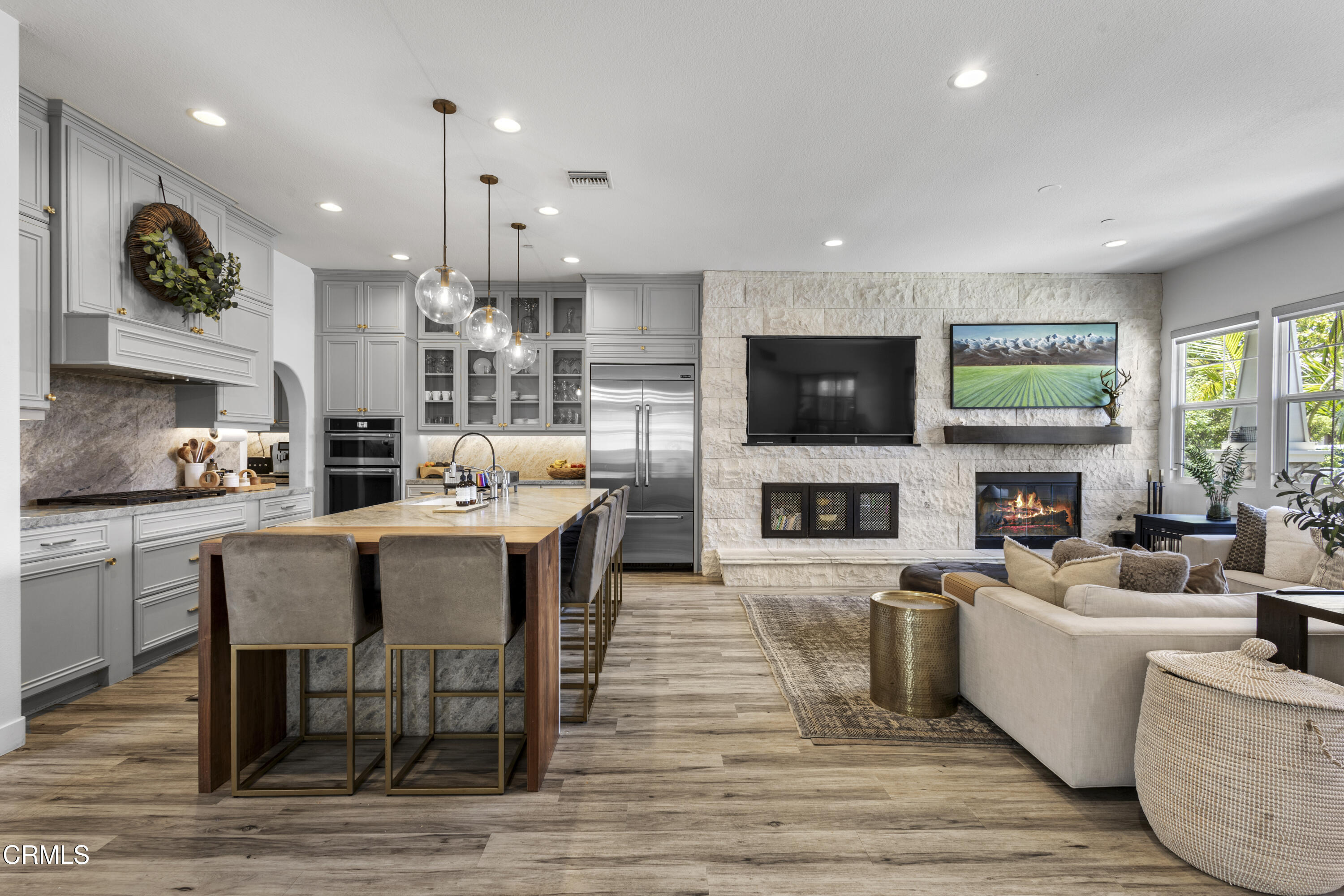 4173 Caribbean Street Oxnard, CA 93035 - Photo 2 of 64 a living room with fireplace furniture and a flat screen tv