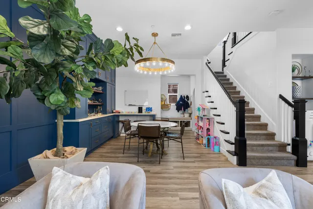 a view of a hallway with wooden floor and windows