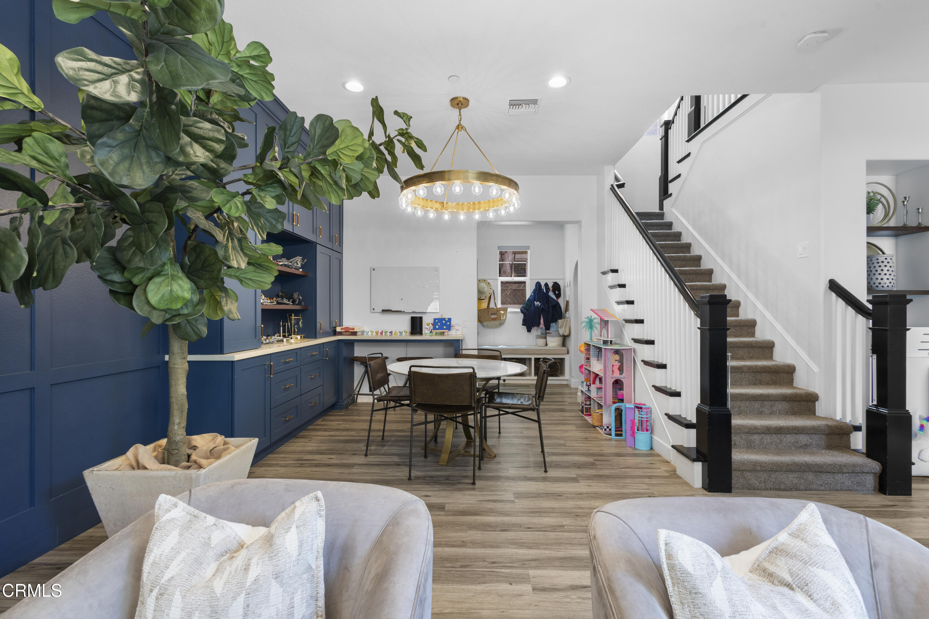 4173 Caribbean Street Oxnard, CA 93035 - Photo 23 of 64 a living room with furniture potted plant and a chandelier