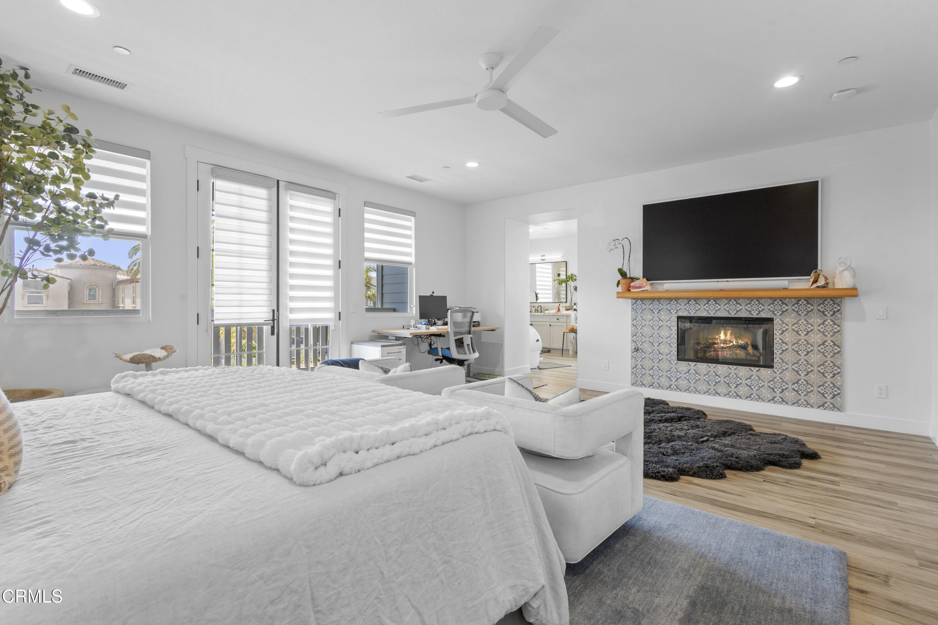 4173 Caribbean Street Oxnard, CA 93035 - Photo 35 of 64 a spacious bedroom with a bed and a flat screen tv