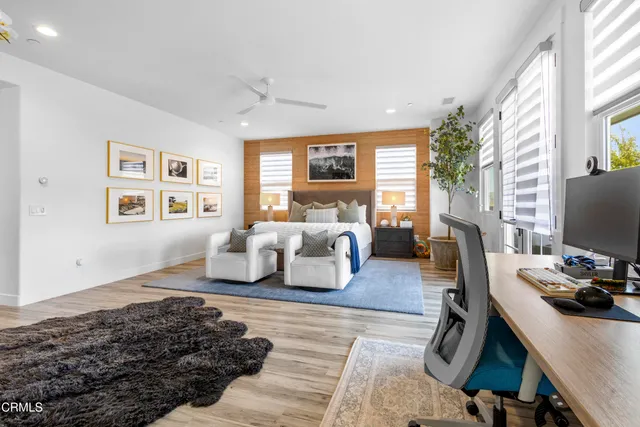a view of a patio with a table and chairs and a fire pit